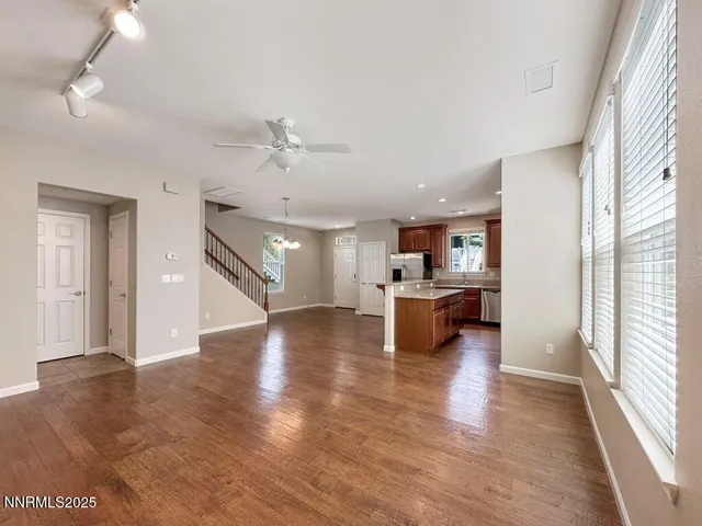 a view of kitchen with stove and cabinets