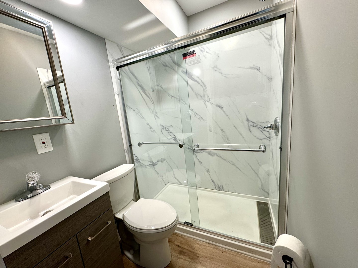 1015 South Maple Street Bloomington, IL 61701 - Photo 11 of 20 a bathroom with a sink and a mirror
