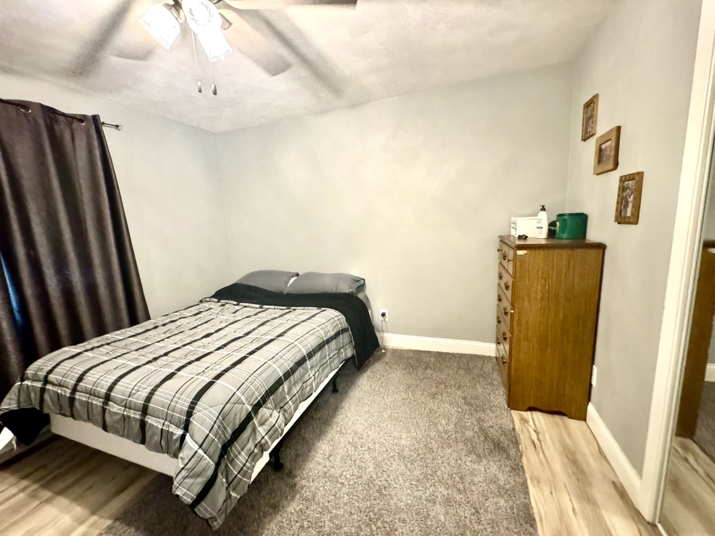 1015 South Maple Street Bloomington, IL 61701 - Photo 9 of 20 a bedroom with a bed and wooden floor