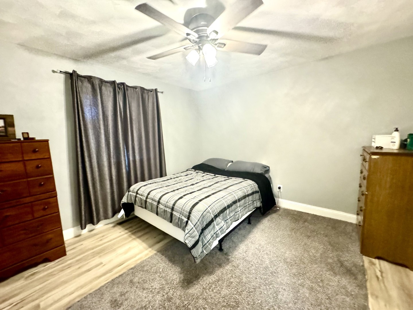 1015 South Maple Street Bloomington, IL 61701 - Photo 10 of 20 a bedroom with a bed and a chandelier