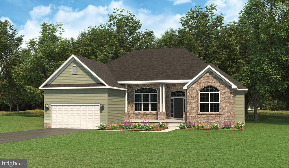 92 Red Stone Lane, Unit 40 Hanover, PA 17331 - Photo 1 of 1 a front view of a house with a garden and yard