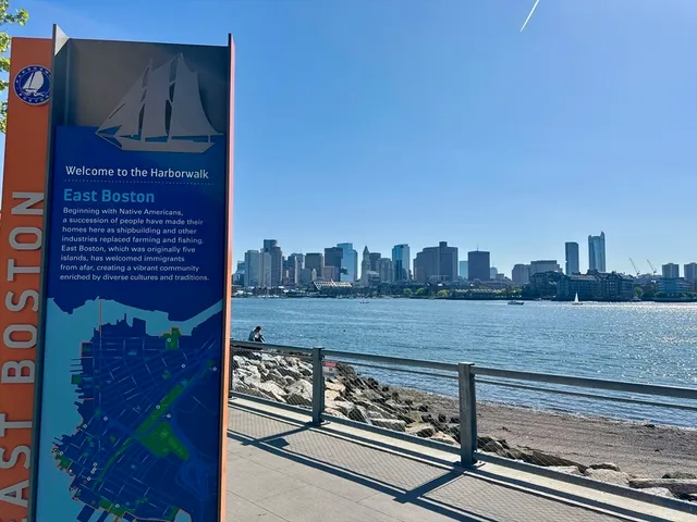 a view of a lake with a table and a chairs