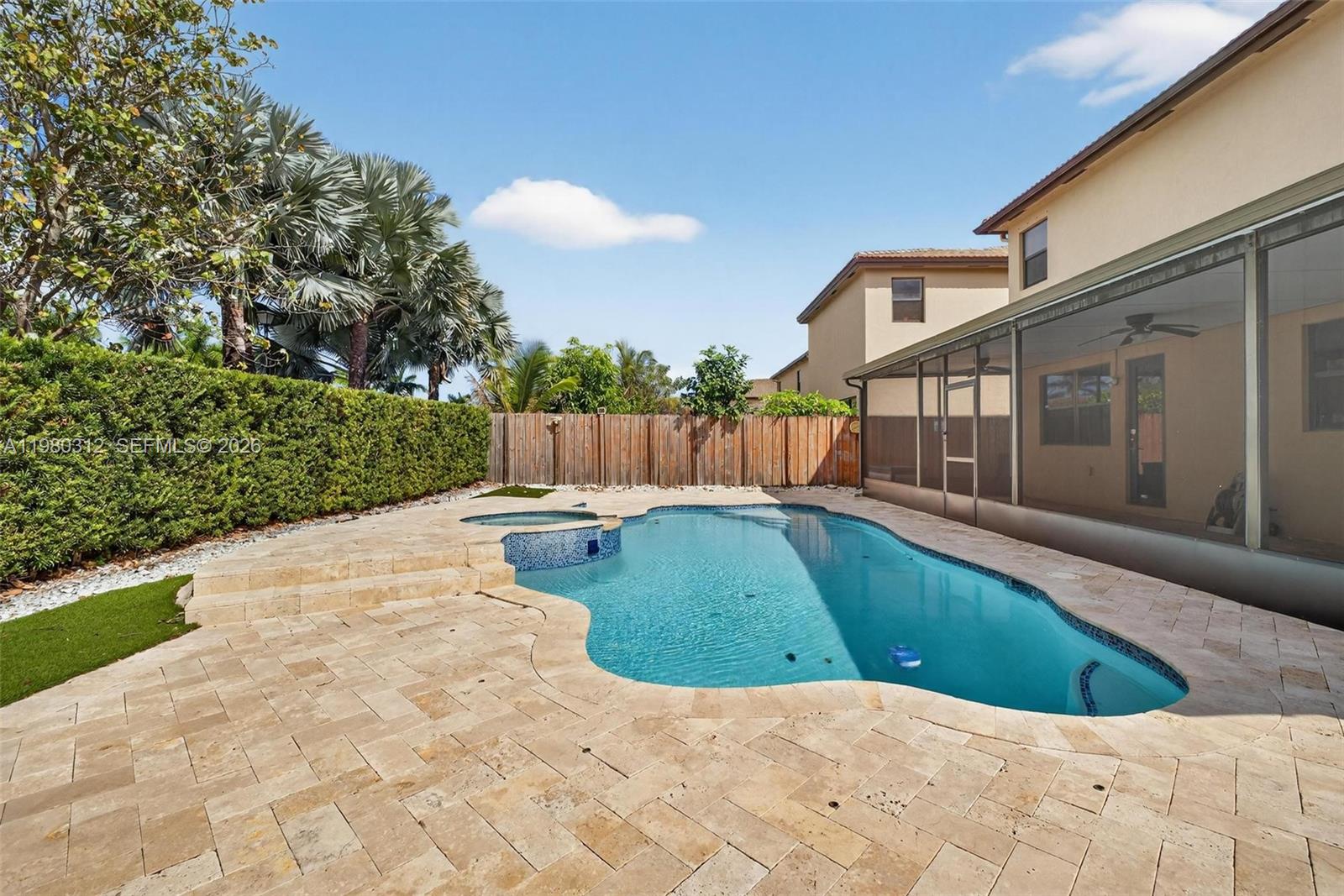 11561 Southwest 232nd Lane, Unit 11561 Homestead, FL 33032 - Photo 25 of 61 a view of a swimming pool with a yard