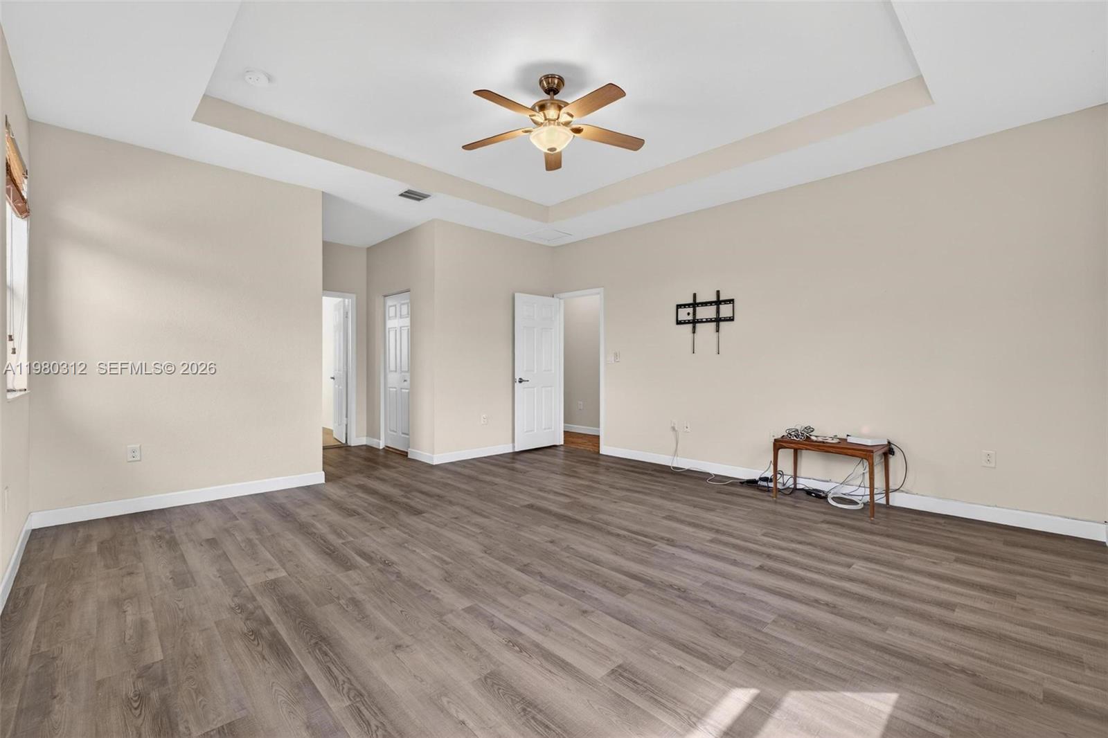 11561 Southwest 232nd Lane, Unit 11561 Homestead, FL 33032 - Photo 30 of 61 wooden floor in a hall with a window