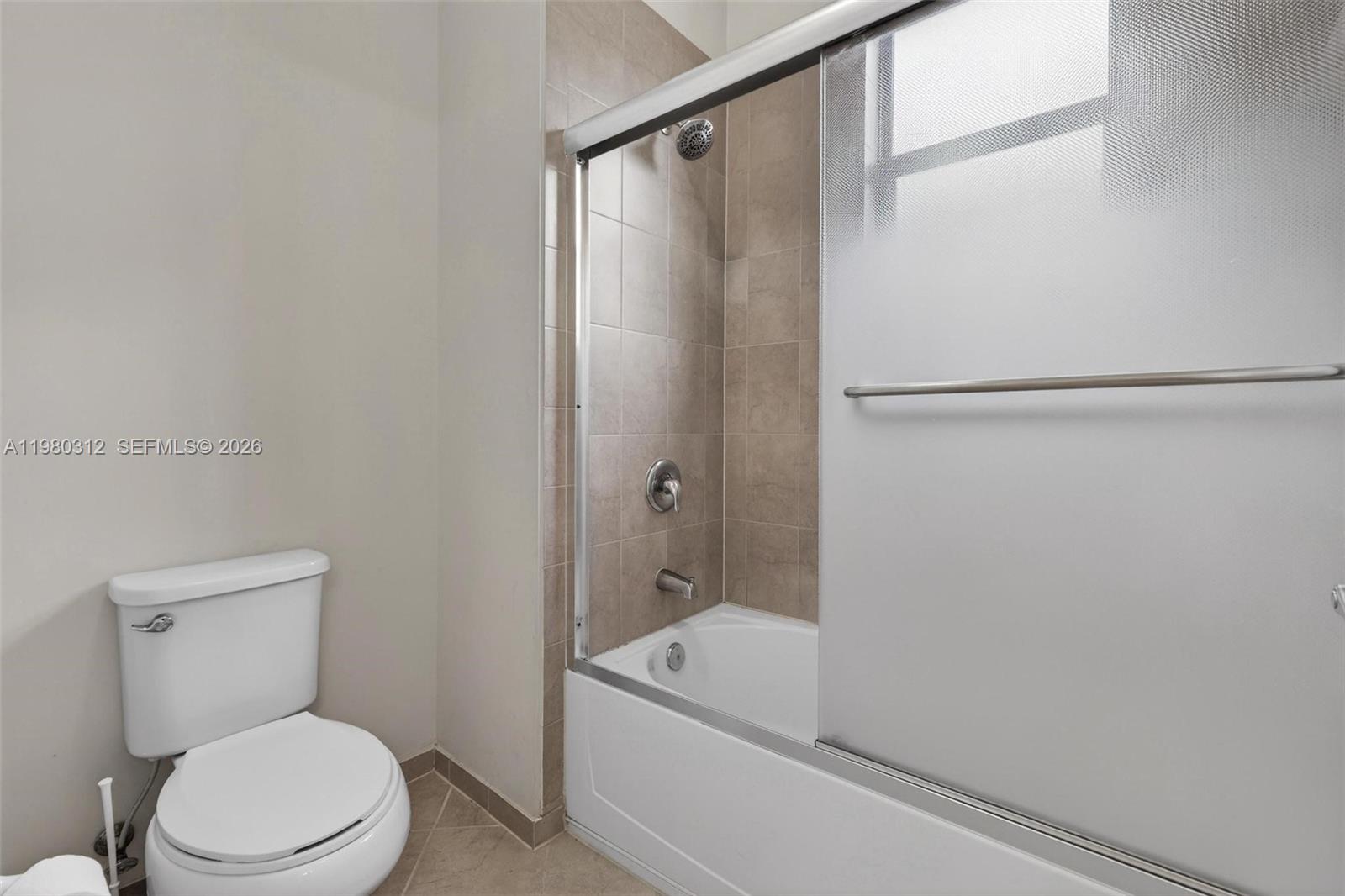 11561 Southwest 232nd Lane, Unit 11561 Homestead, FL 33032 - Photo 41 of 61 a bathroom with a toilet and a shower