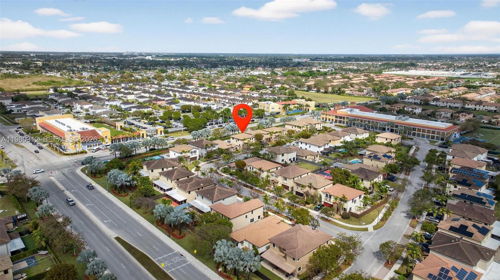 11561 Southwest 232nd Lane, Unit 11561 Homestead, FL 33032 - Photo 52 of 61 an aerial view of residential building with outdoor space