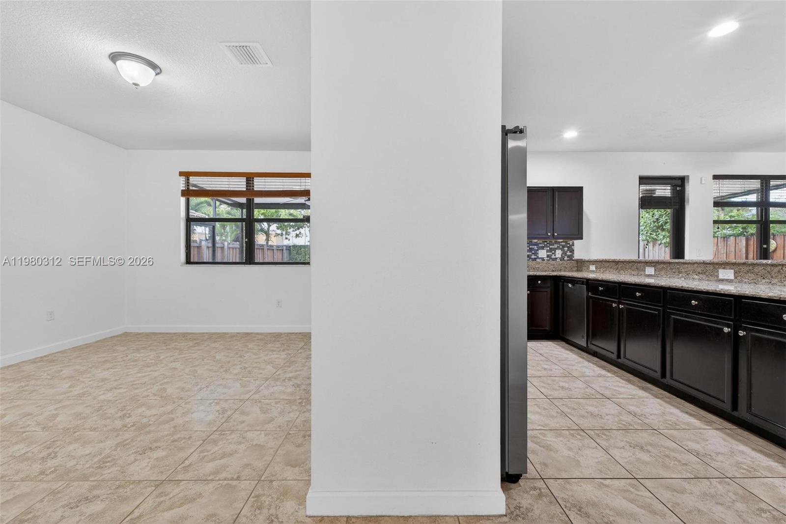 11561 Southwest 232nd Lane, Unit 11561 Homestead, FL 33032 - Photo 9 of 61 a view of a kitchen with a sink and a window
