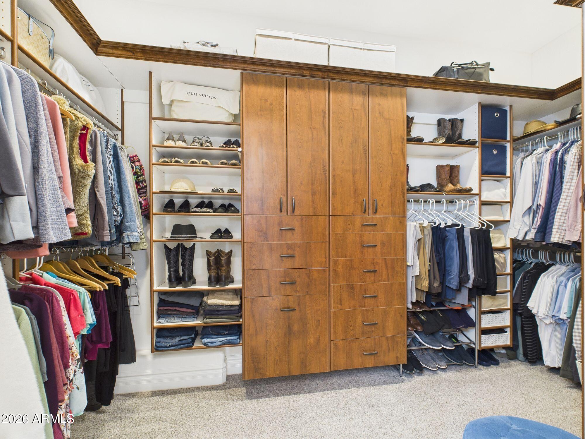 1006 West Rock Springs Circle Payson, AZ 85541 - Photo 15 of 35 a view of walk in closet with clothes and shoes