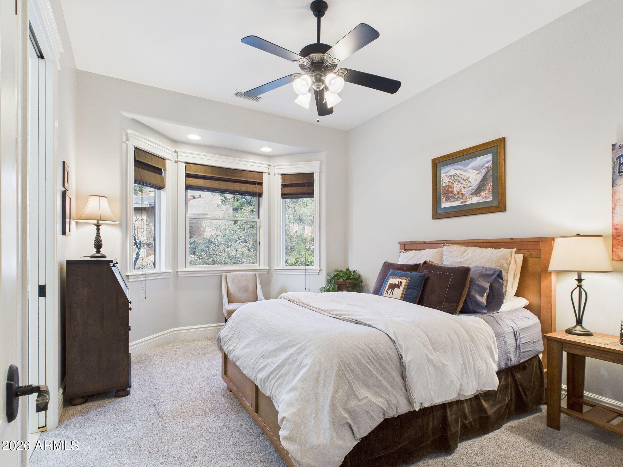 1006 West Rock Springs Circle Payson, AZ 85541 - Photo 18 of 35 a bedroom with a large bed and a window