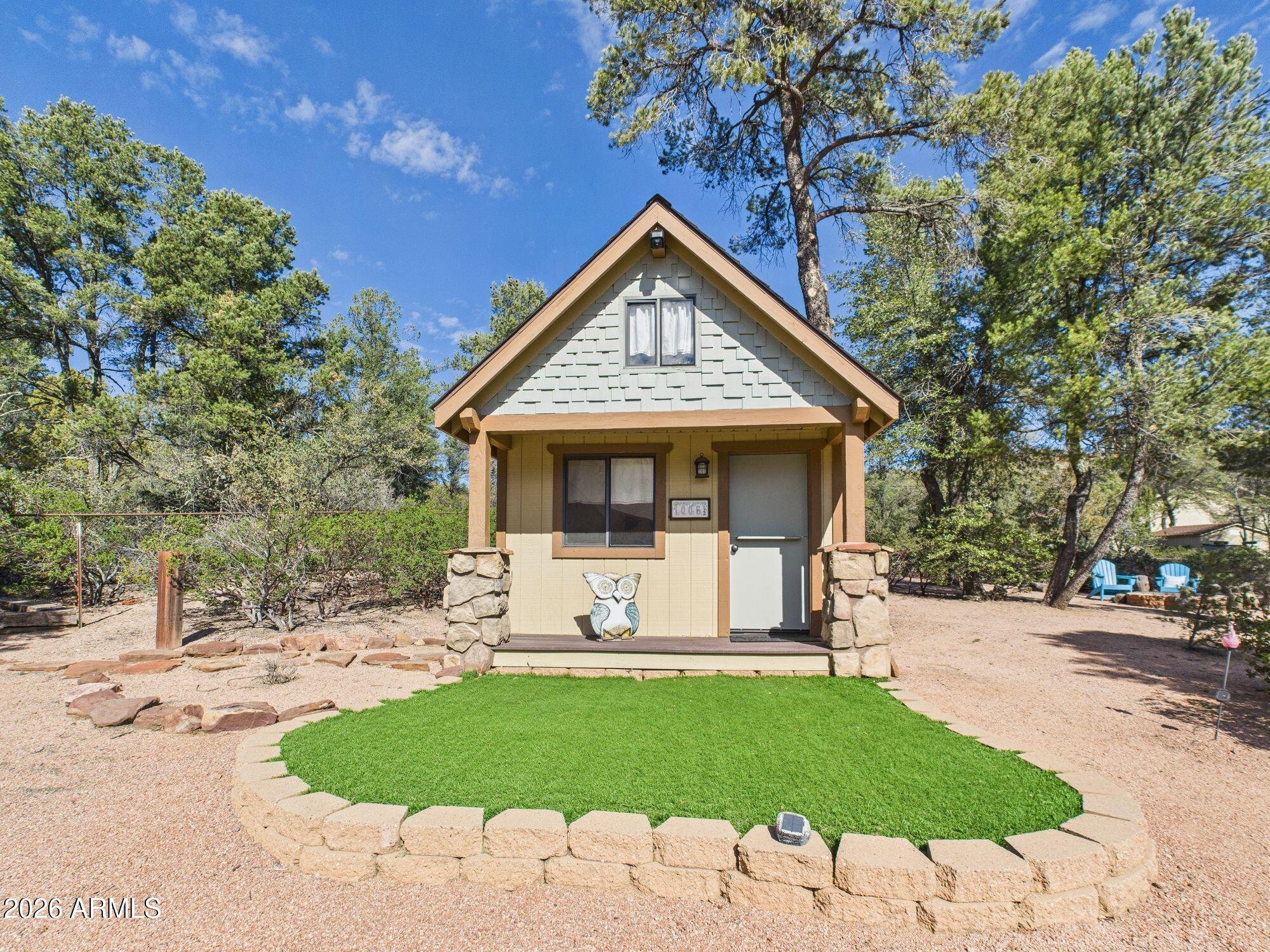 1006 West Rock Springs Circle Payson, AZ 85541 - Photo 25 of 35 a view of a white house with a yard