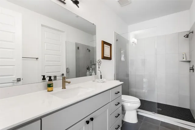 a view of a workspace with furniture and a bookshelf