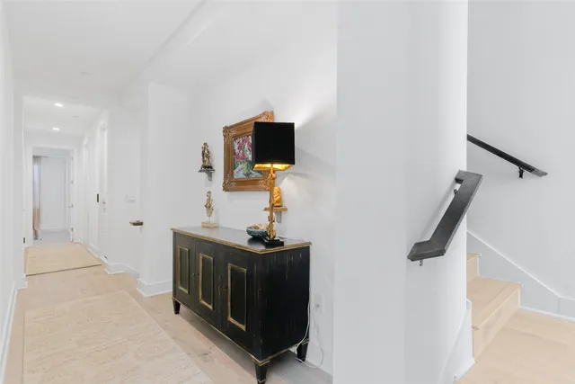 a white toilet sitting next to a bathroom sink