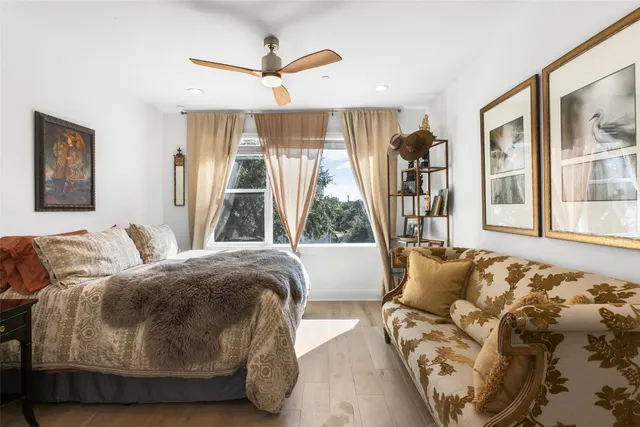 a bathroom with a sink a toilet and shower curtain
