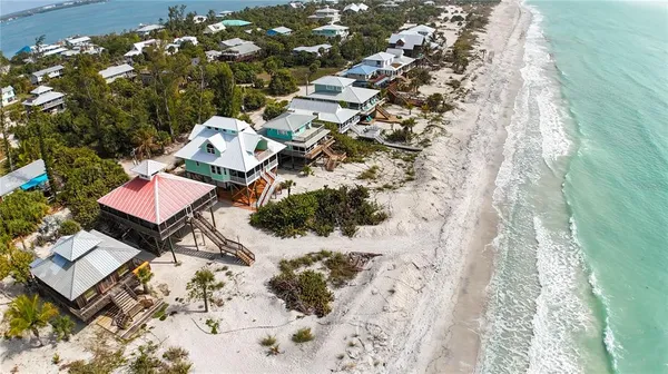 a aerial view of a house with a yard
