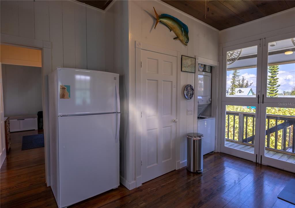 8796 Grand Avenue Boca Grande, FL 33921 - Photo 13 of 19 a white refrigerator freezer and a wooden floor