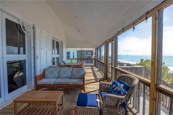 a view of a balcony with wooden floor