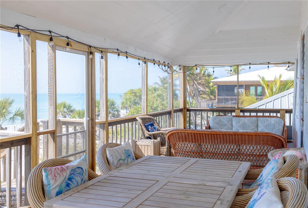 8796 Grand Avenue Boca Grande, FL 33921 - Photo 5 of 19 a view of a balcony with wooden floor