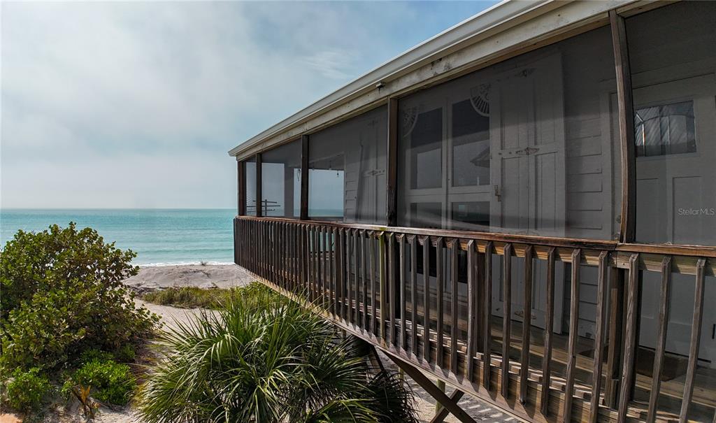 8796 Grand Avenue Boca Grande, FL 33921 - Photo 6 of 19 a balcony with wooden floor