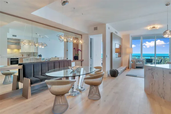 a room with dining table and chairs