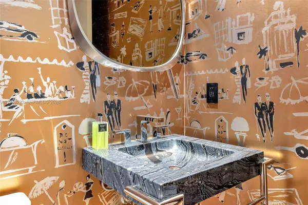 a table with a sink and wooden floor