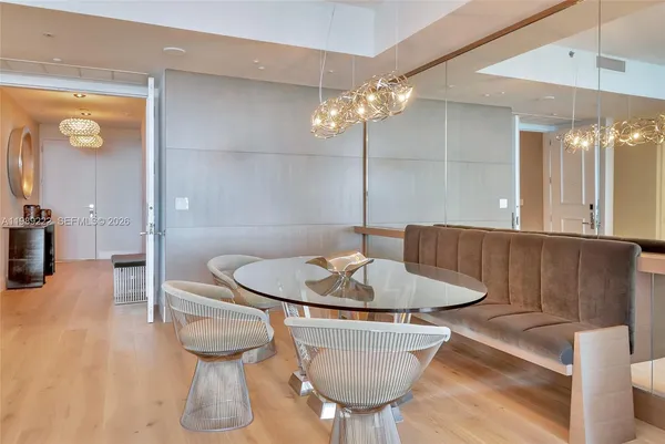 a dining room with furniture and wooden floor