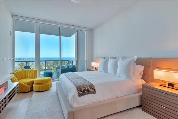 a bedroom with bed and a couch