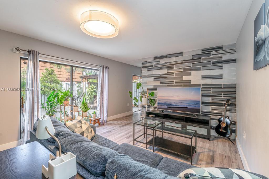 9146 Southwest 23rd Street Davie, FL 33324 - Photo 15 of 21 a living room with furniture and a fireplace