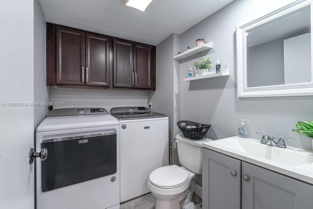 9146 Southwest 23rd Street Davie, FL 33324 - Photo 17 of 21 a view of bathroom with a sink a toilet and a window