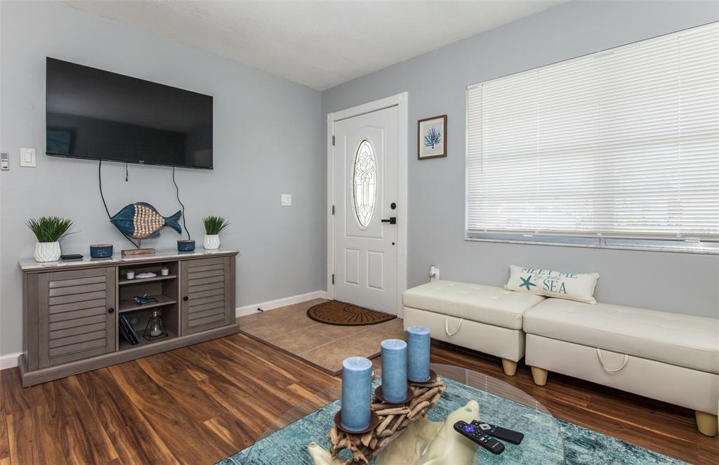 140 Columbia Road Venice, FL 34293 - Photo 11 of 30 a living room with furniture and a flat screen tv
