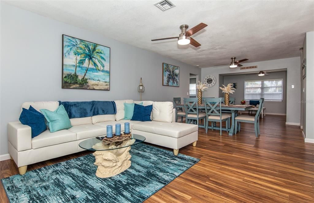 140 Columbia Road Venice, FL 34293 - Photo 12 of 30 a living room with furniture or couch and a dining table