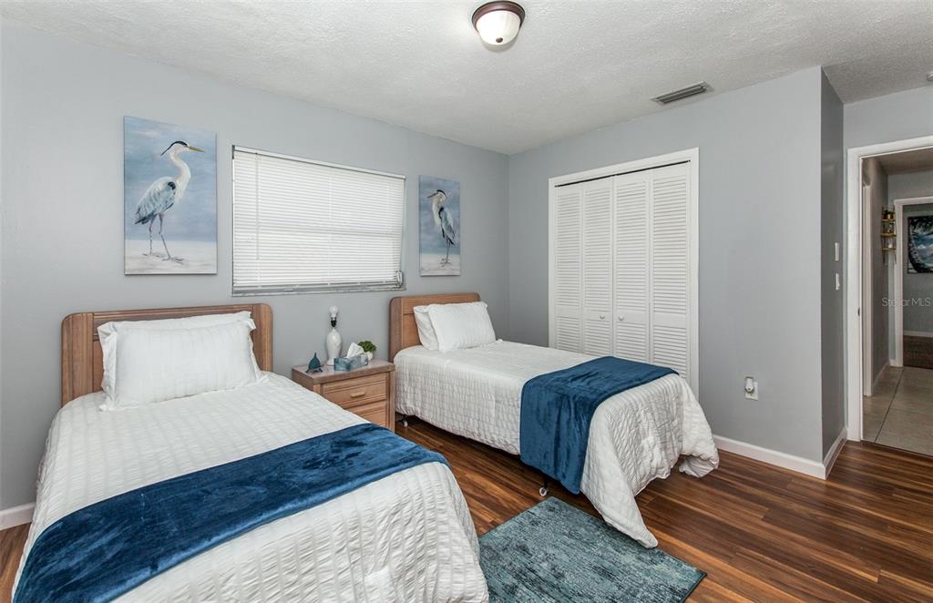 140 Columbia Road Venice, FL 34293 - Photo 14 of 30 a bedroom with two beds and a window
