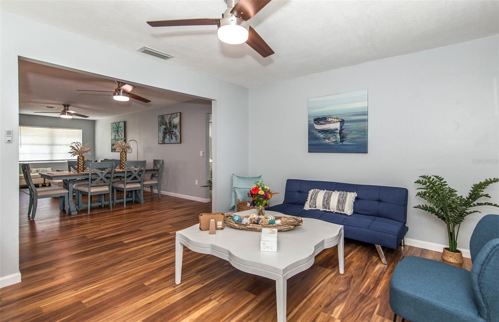 140 Columbia Road Venice, FL 34293 - Photo 19 of 30 a living room with furniture and wooden floor