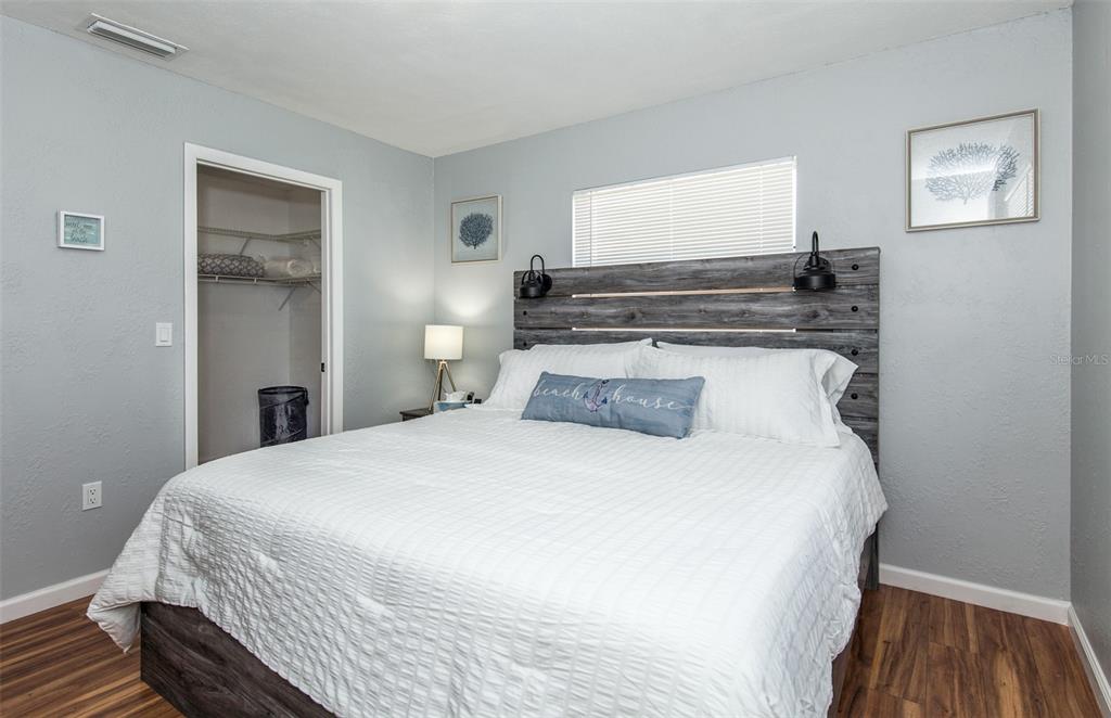 140 Columbia Road Venice, FL 34293 - Photo 22 of 30 a bedroom with a bed and wooden floor