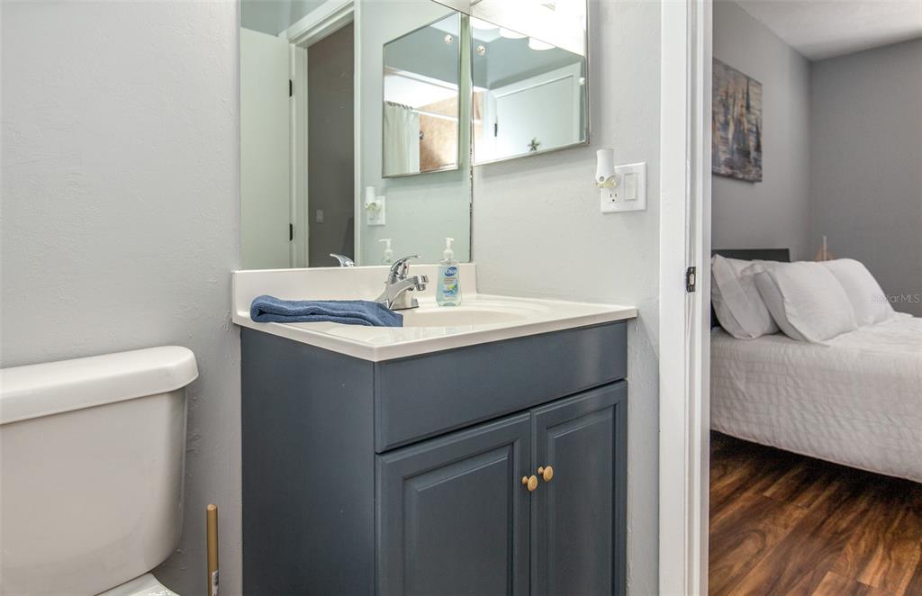 140 Columbia Road Venice, FL 34293 - Photo 25 of 30 a bathroom with a sink and a mirror