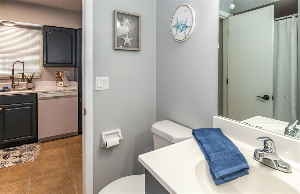 140 Columbia Road Venice, FL 34293 - Photo 27 of 30 a bathroom with a toilet a sink and mirror