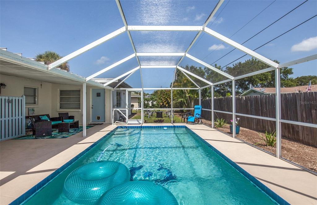 140 Columbia Road Venice, FL 34293 - Photo 30 of 30 a view of a backyard with a patio and wooden fence