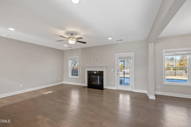 a kitchen with granite countertop white cabinets and stainless steel appliances