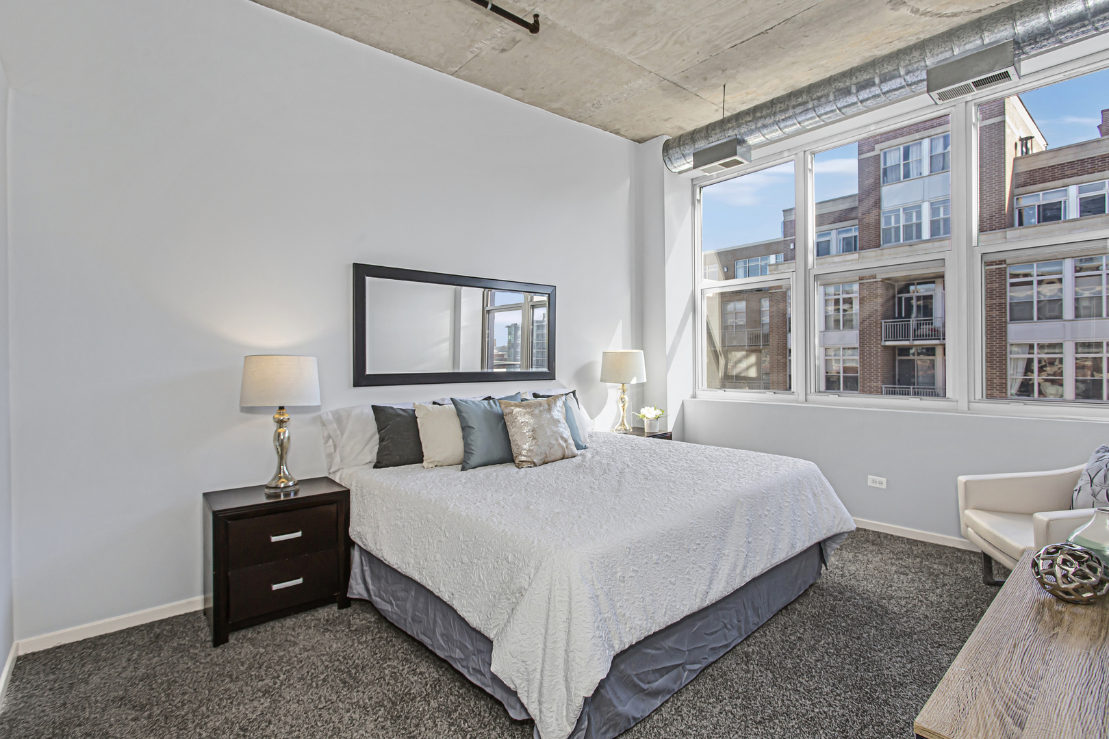 1000 West Adams Street, Unit 706 Chicago, IL 60607 - Photo 7 of 9 a bedroom with a bed and a window