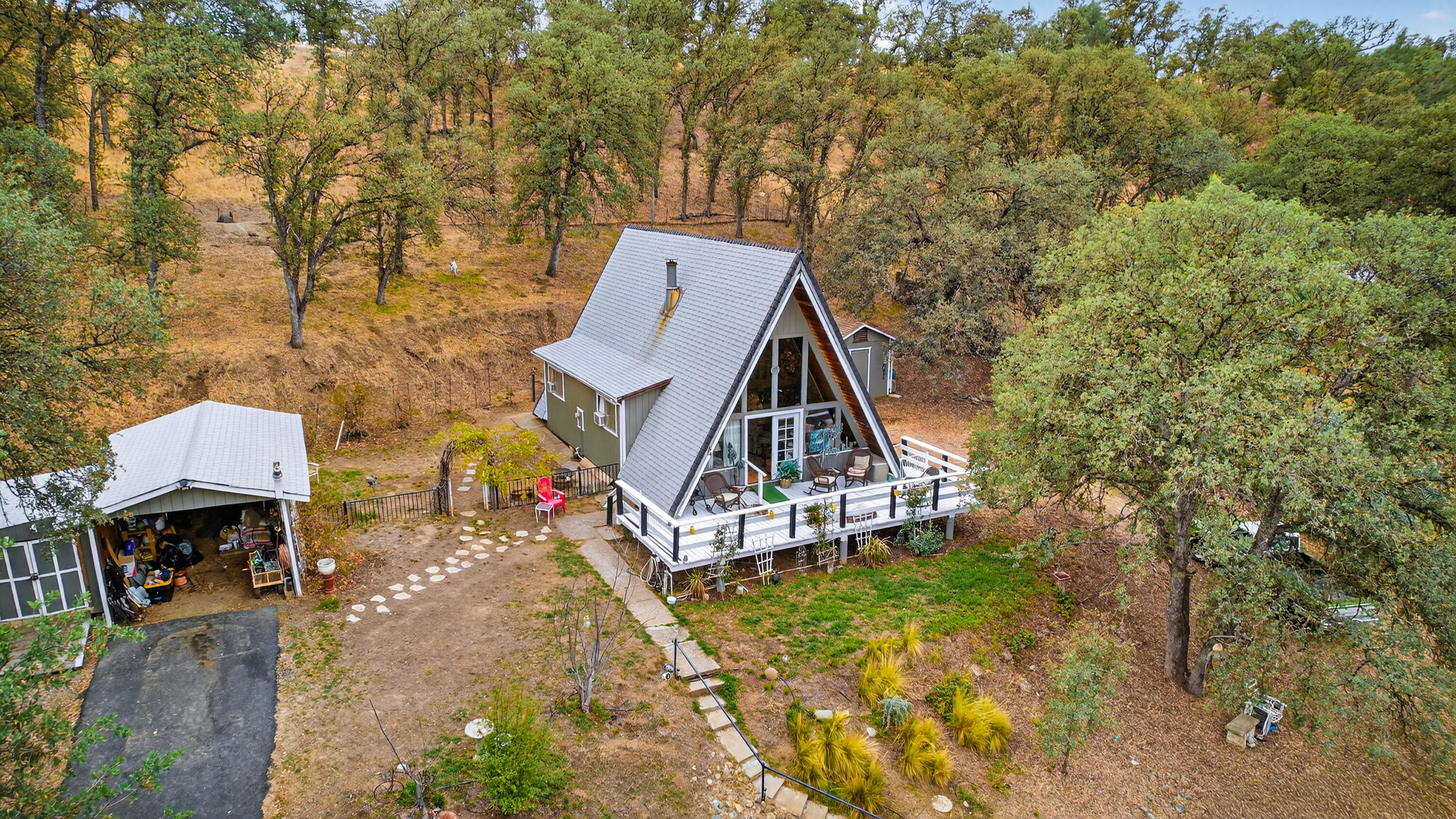 16937 Stagecoach Road Corning, CA 96021 - Photo 13 of 24 a view of a house with wooden fence
