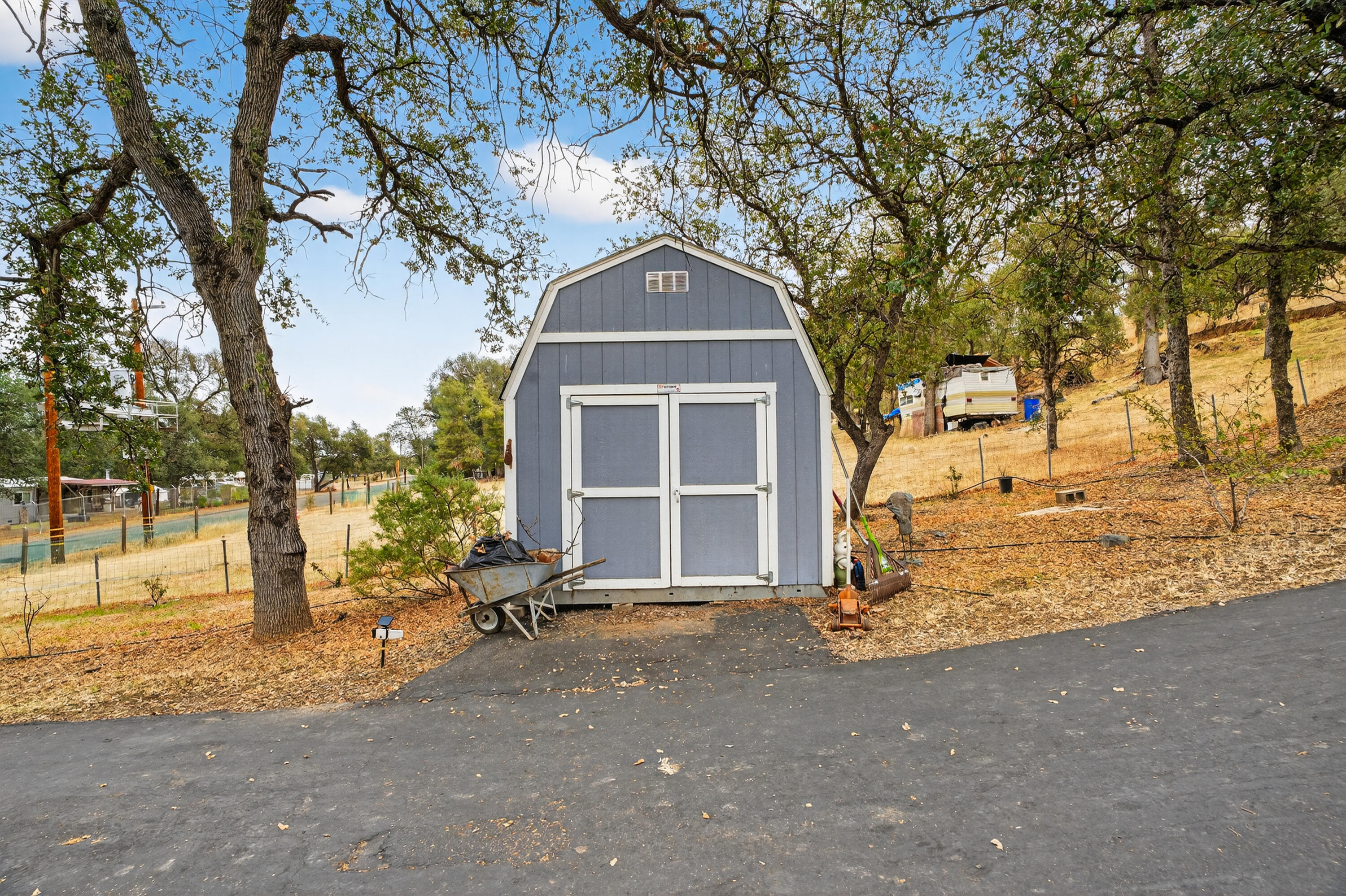 16937 Stagecoach Road Corning, CA 96021 - Photo 14 of 24 a front view of a house with a yard