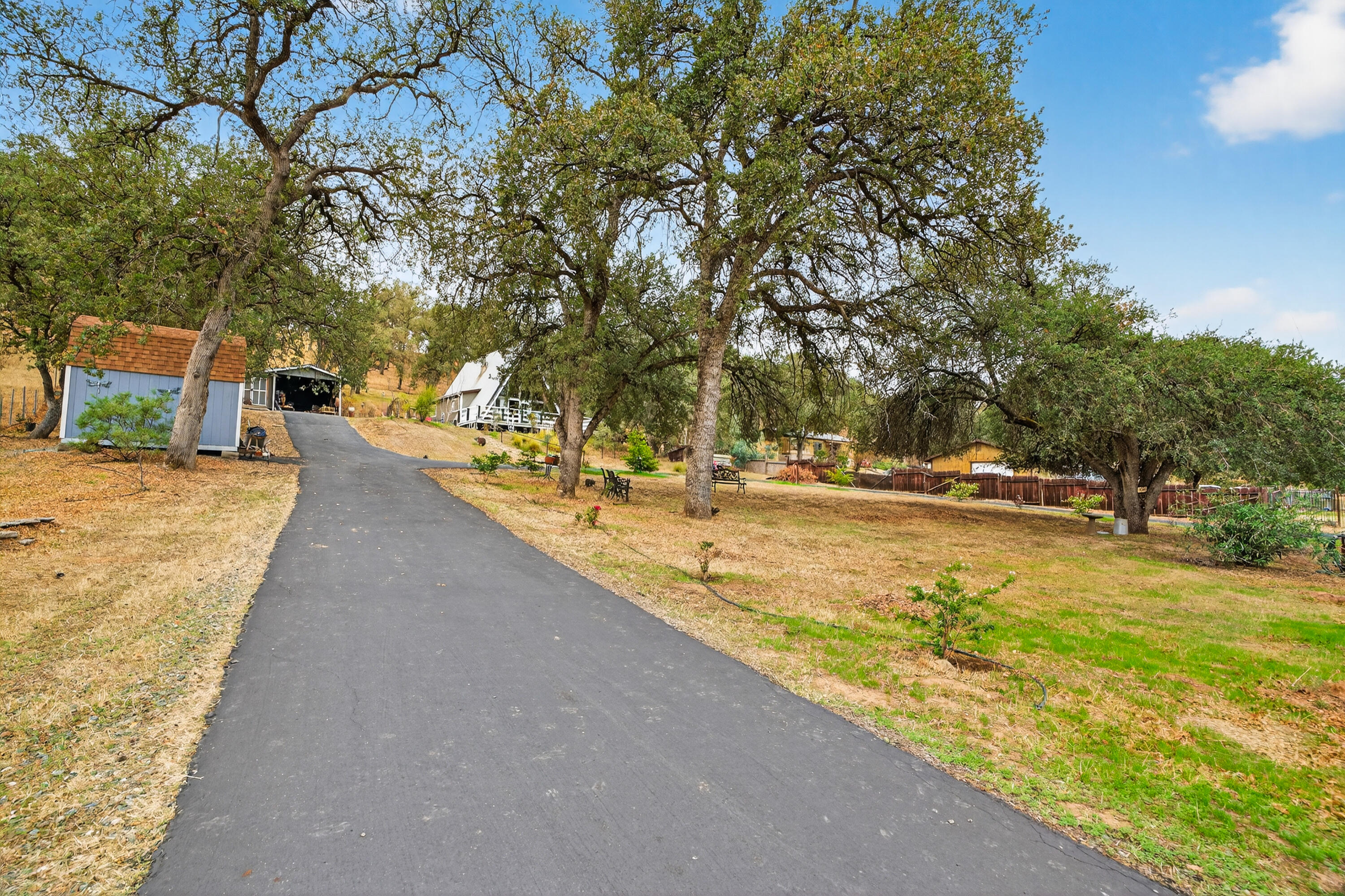 16937 Stagecoach Road Corning, CA 96021 - Photo 17 of 24 a swimming pool with outdoor seating and yard