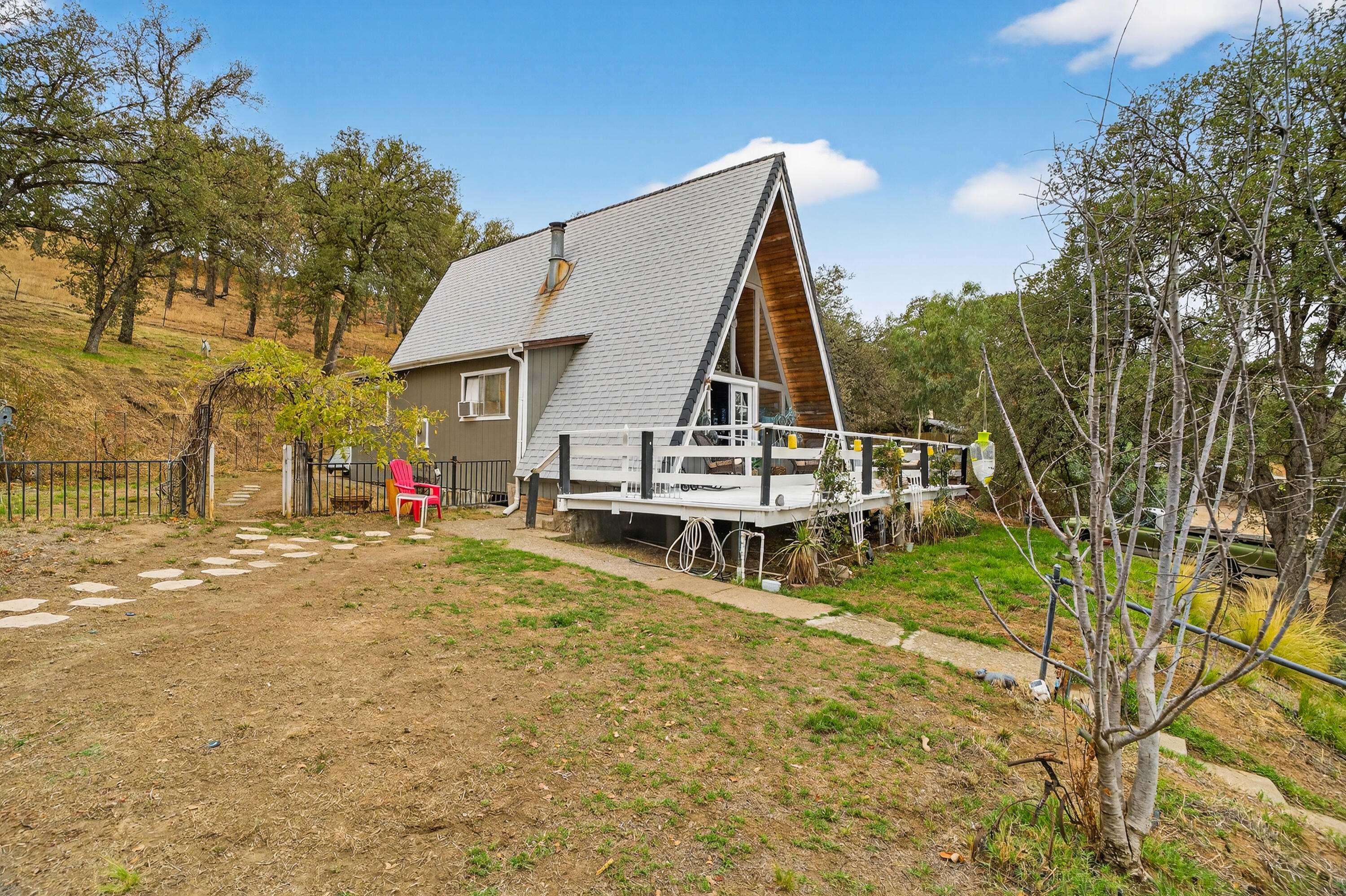 16937 Stagecoach Road Corning, CA 96021 - Photo 2 of 24 a view of a house with pool and sitting area
