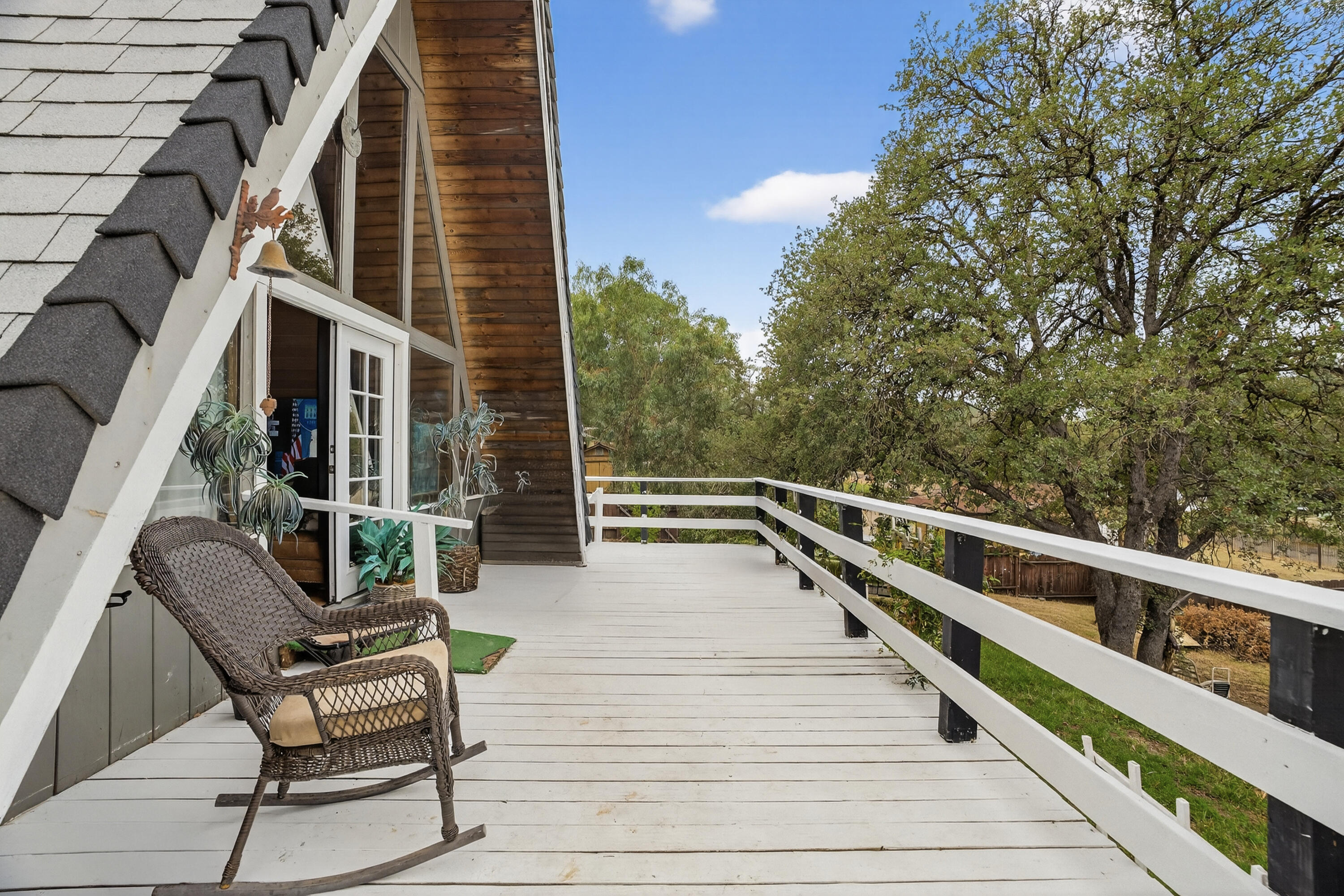16937 Stagecoach Road Corning, CA 96021 - Photo 4 of 24 a view of balcony with wooden floor and outdoor seating