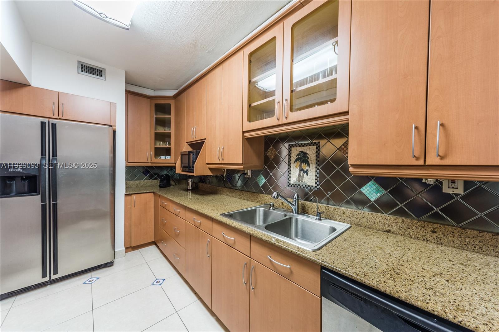 121 Crandon Boulevard, Unit 248 Key Biscayne, FL 33149 - Photo 13 of 37 a kitchen that has a sink and a granite counter tops
