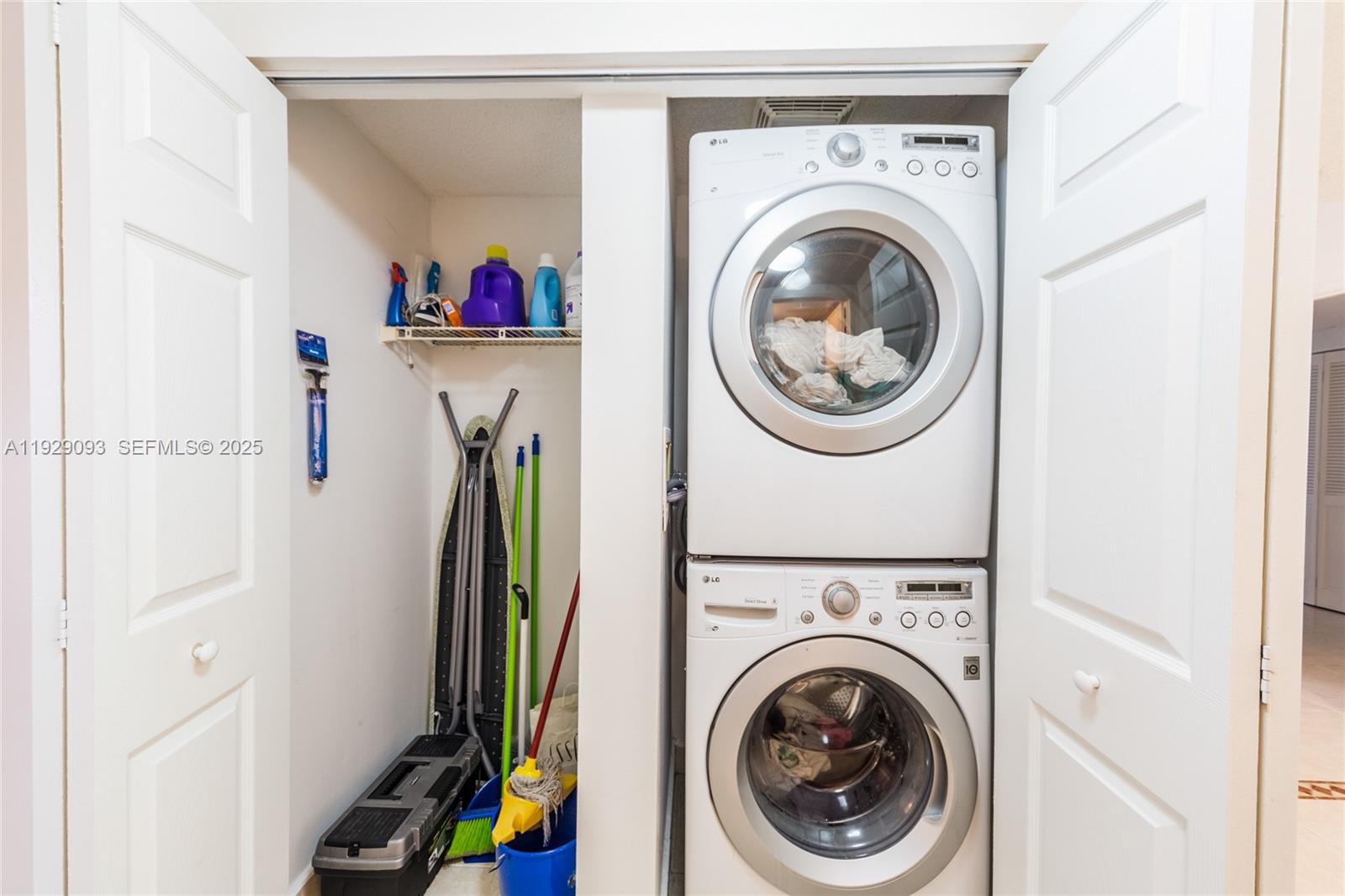 121 Crandon Boulevard, Unit 248 Key Biscayne, FL 33149 - Photo 28 of 37 a view of a storage and utility room with dryer and washer