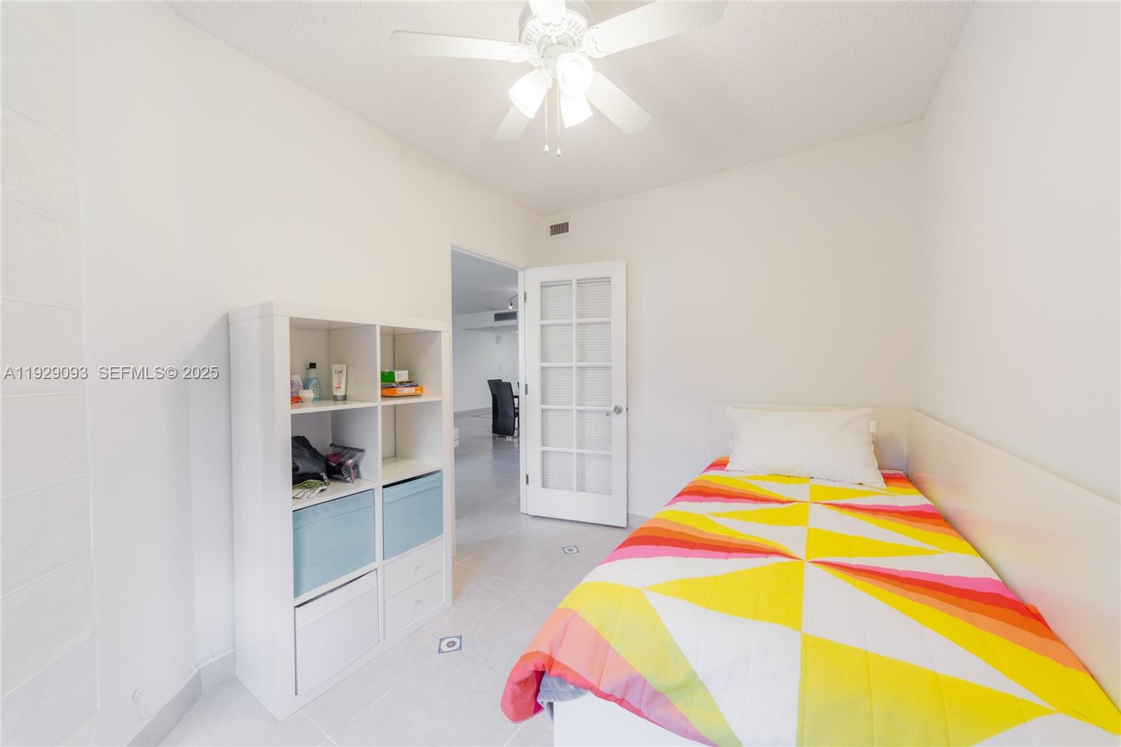 121 Crandon Boulevard, Unit 248 Key Biscayne, FL 33149 - Photo 30 of 37 a room with kitchen island and stainless steel appliances