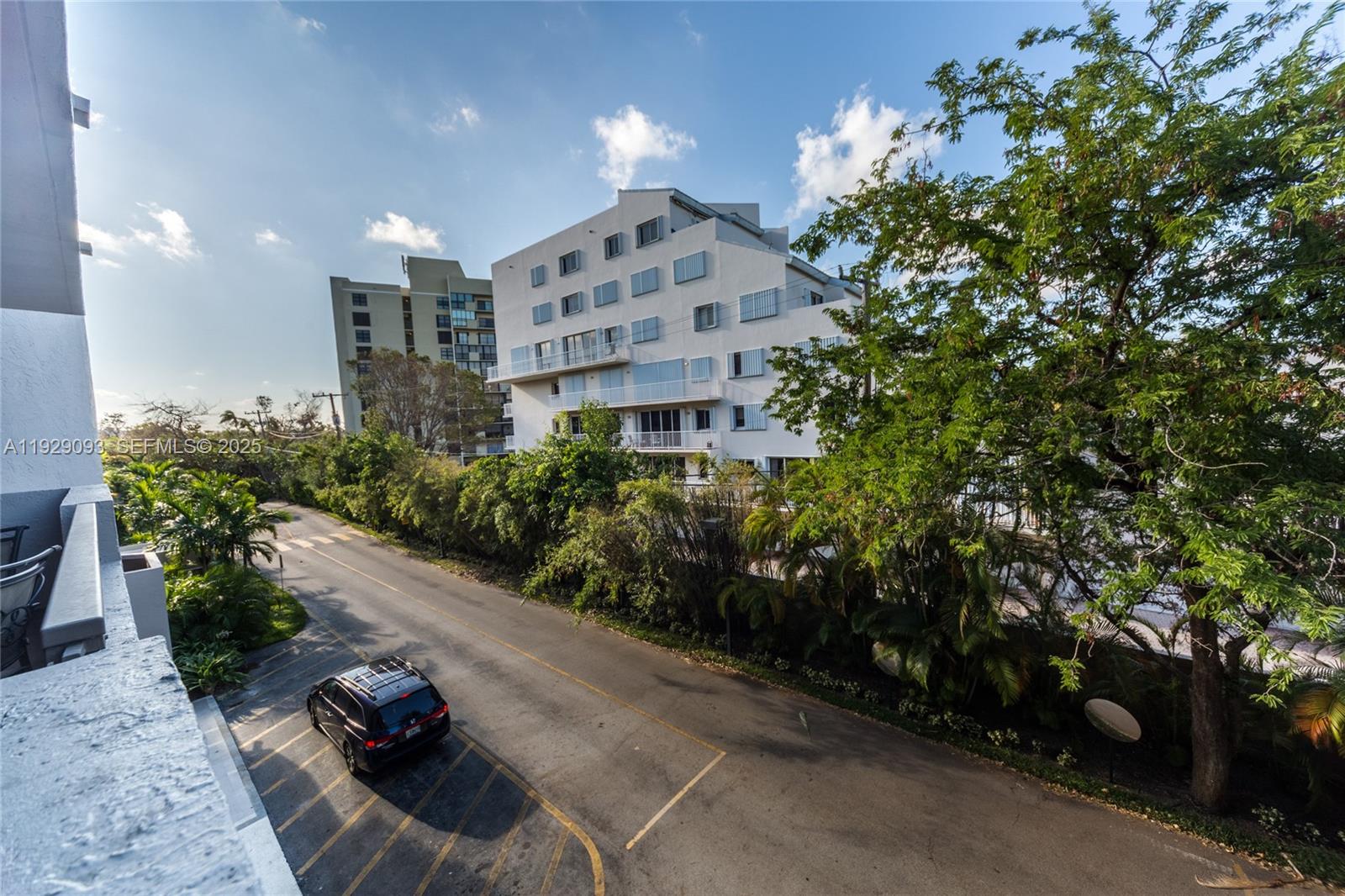 121 Crandon Boulevard, Unit 248 Key Biscayne, FL 33149 - Photo 31 of 37 a view of a chairs and table in backyard
