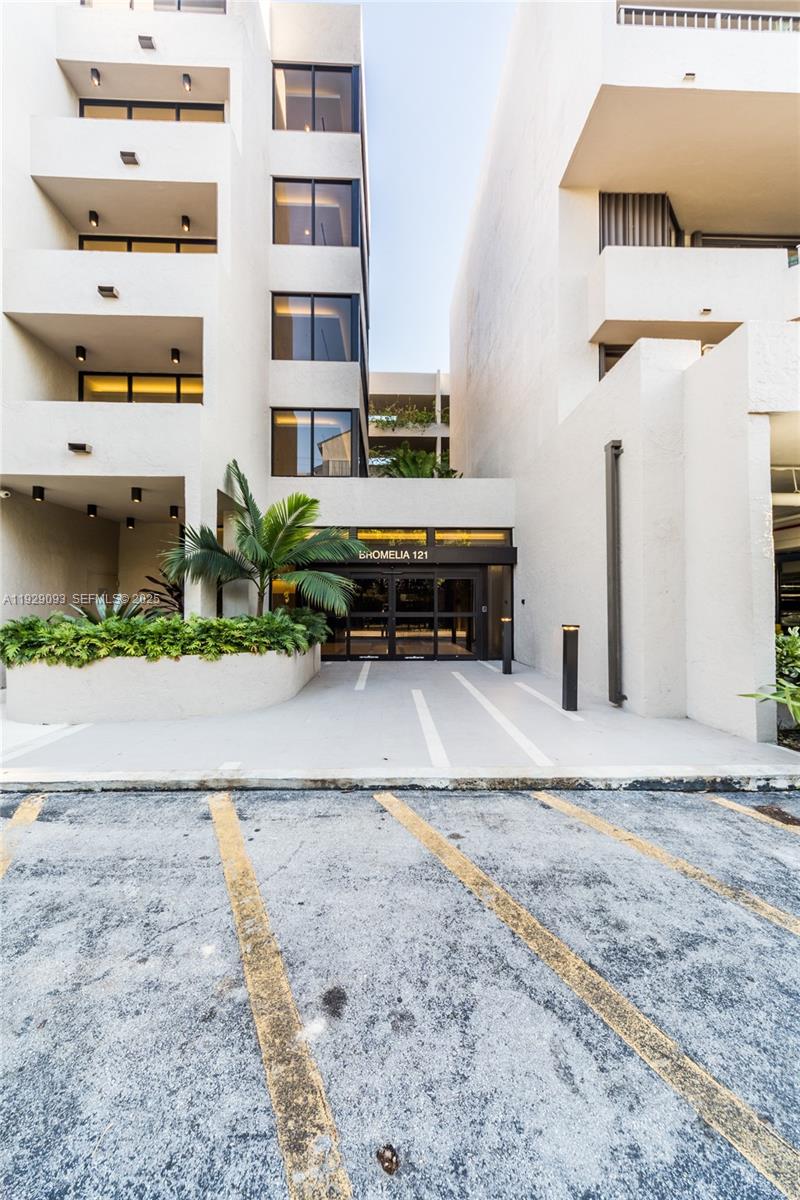 121 Crandon Boulevard, Unit 248 Key Biscayne, FL 33149 - Photo 37 of 37 a view of a house with a yard