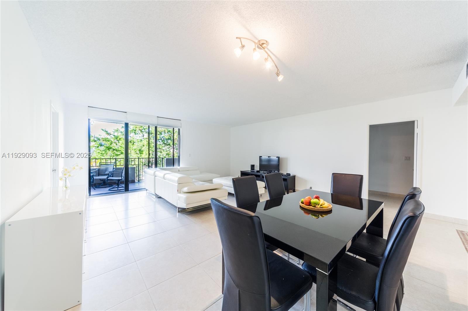 121 Crandon Boulevard, Unit 248 Key Biscayne, FL 33149 - Photo 9 of 37 a view of a dining room with a table and chairs