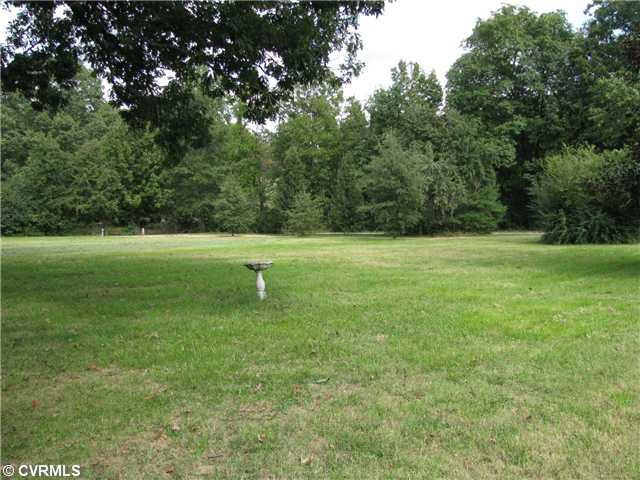 3337 Pleasants Road Powhatan, VA 23139 - Photo 3 of 10 Exterior Front - Front Yard - looking towards the street. Private on both sides and back! Beautiful trees including pear and apple. Open area is perfect for a large garden!